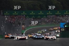 Start of the race, The #12 Cadillac Hertz Team JOTA Cadillac V-Series.R of Will Stevens and  Norman Nato leads The #38 Cadillac Hertz Team JOTA Cadillac V-Series.R of Earl Bamber, Sebastien Bourdais and Jack Aitken 